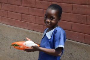 After school program kids receiving lunch.